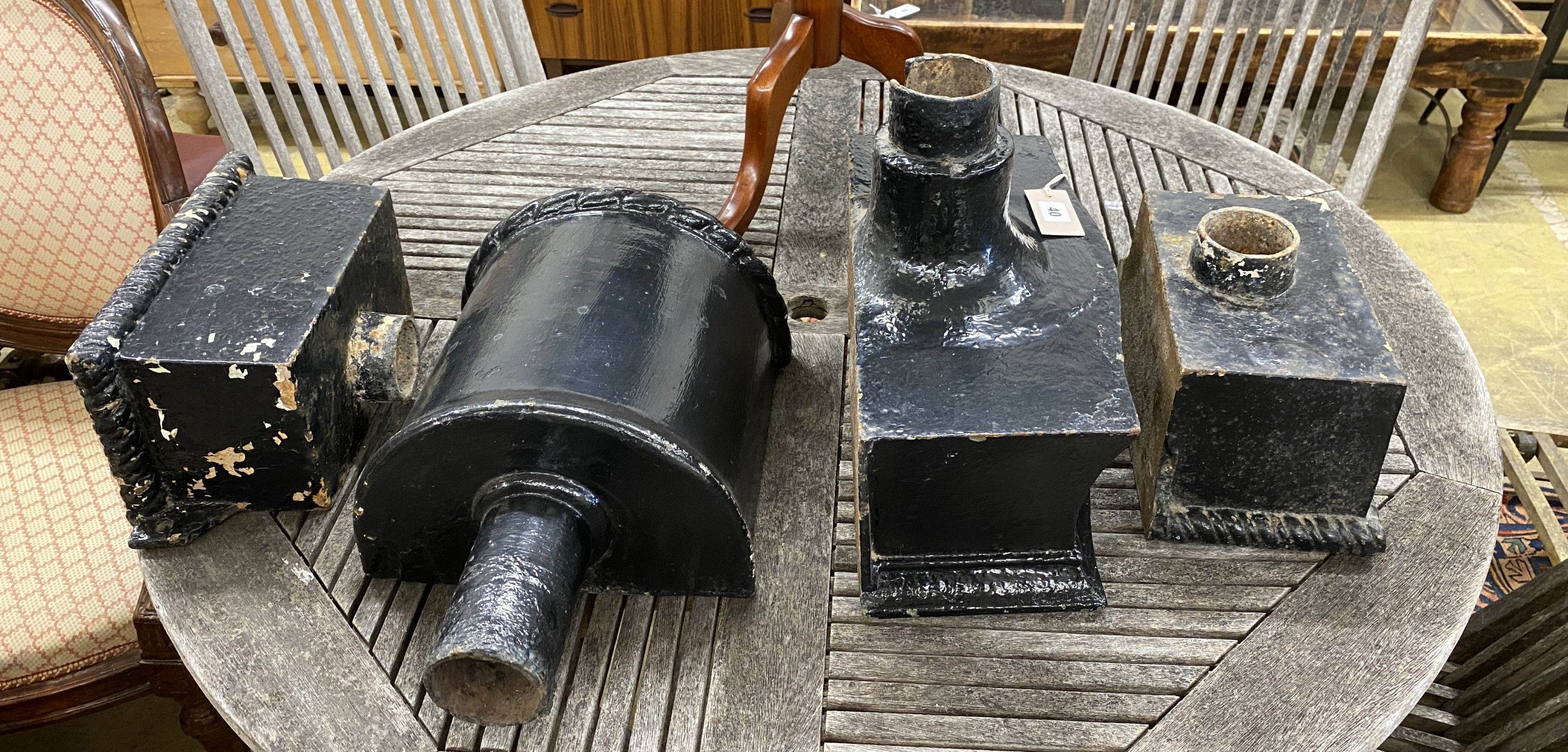 Four assorted cast iron hoppers